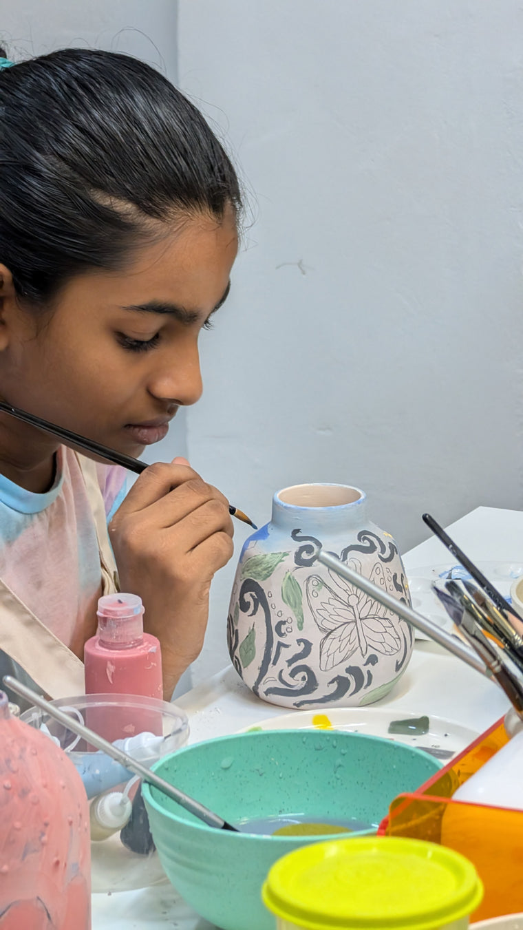 Kids pottery painting at Clay Clay